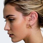Molten Curve Gold Stud Earrings by Lavana, on model fluid sculptural curved studs 