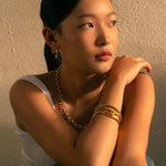 Molten Open Gold Cuff Bracelet by Lavana, on model; modern sculptural openwork silhouette