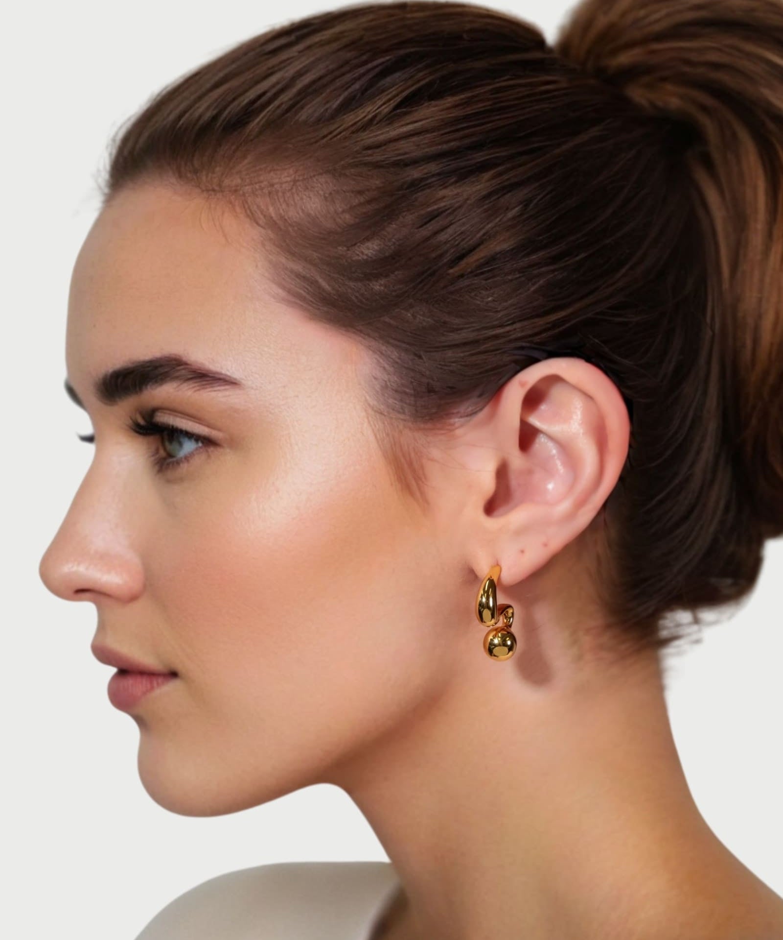 Molten Orb Gold Stud Earrings by Lavana on model sculptural stud with polished orb accent