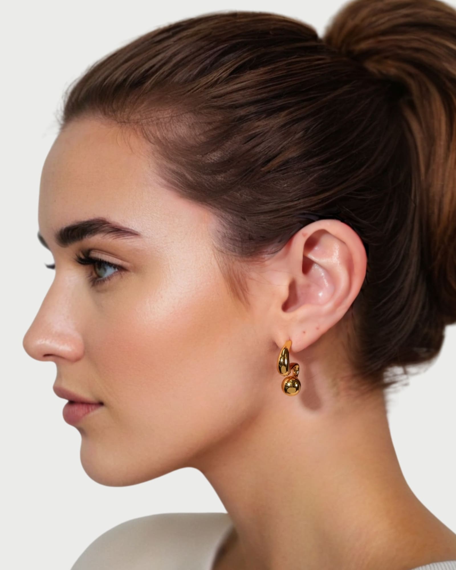 Molten Orb Gold Stud Earrings by Lavana on model sculptural stud with polished orb accent