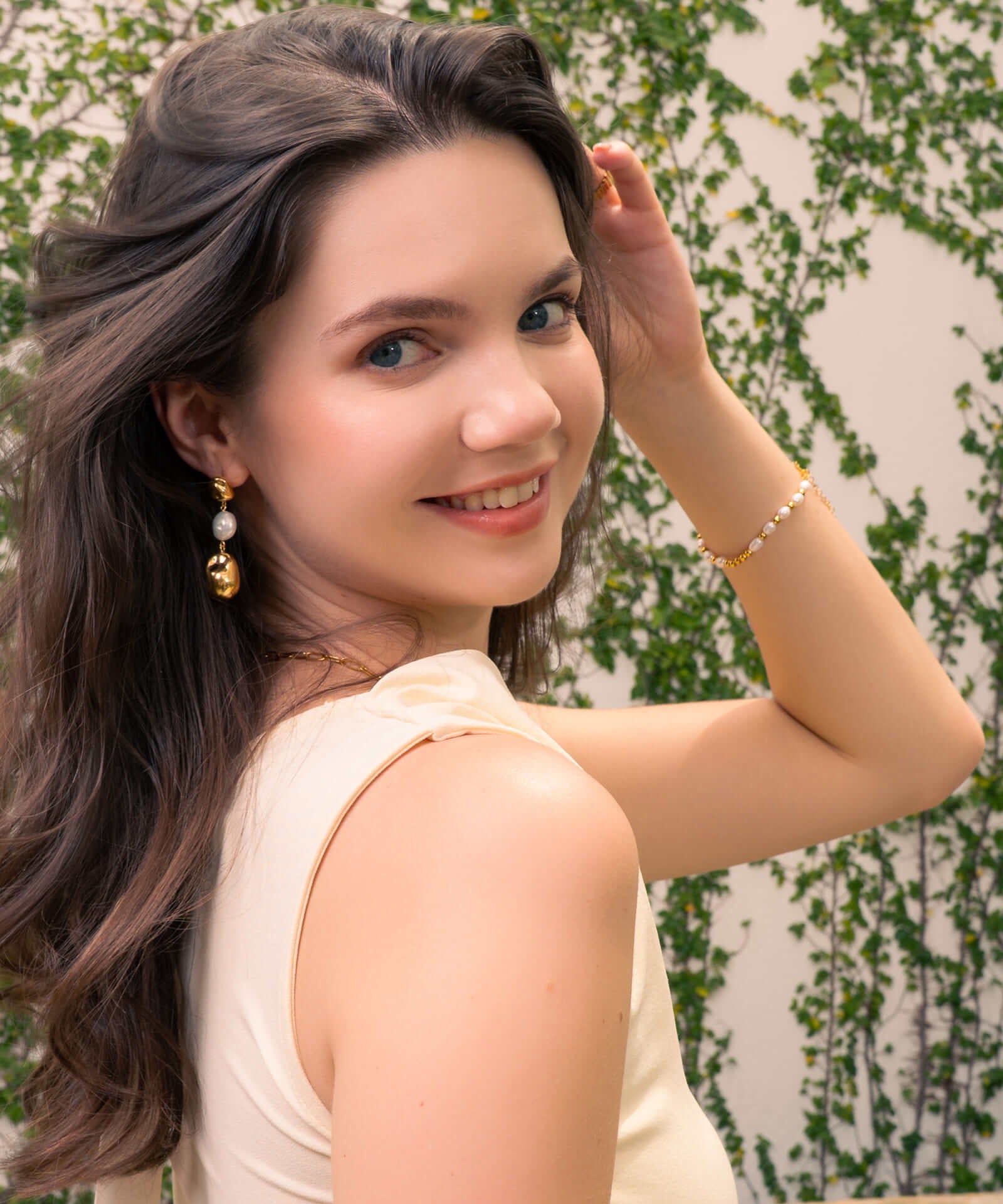 Moontide Gold Pearl Bracelet by Lavana, on model; freshwater pearls polished gold beads and extender chain 