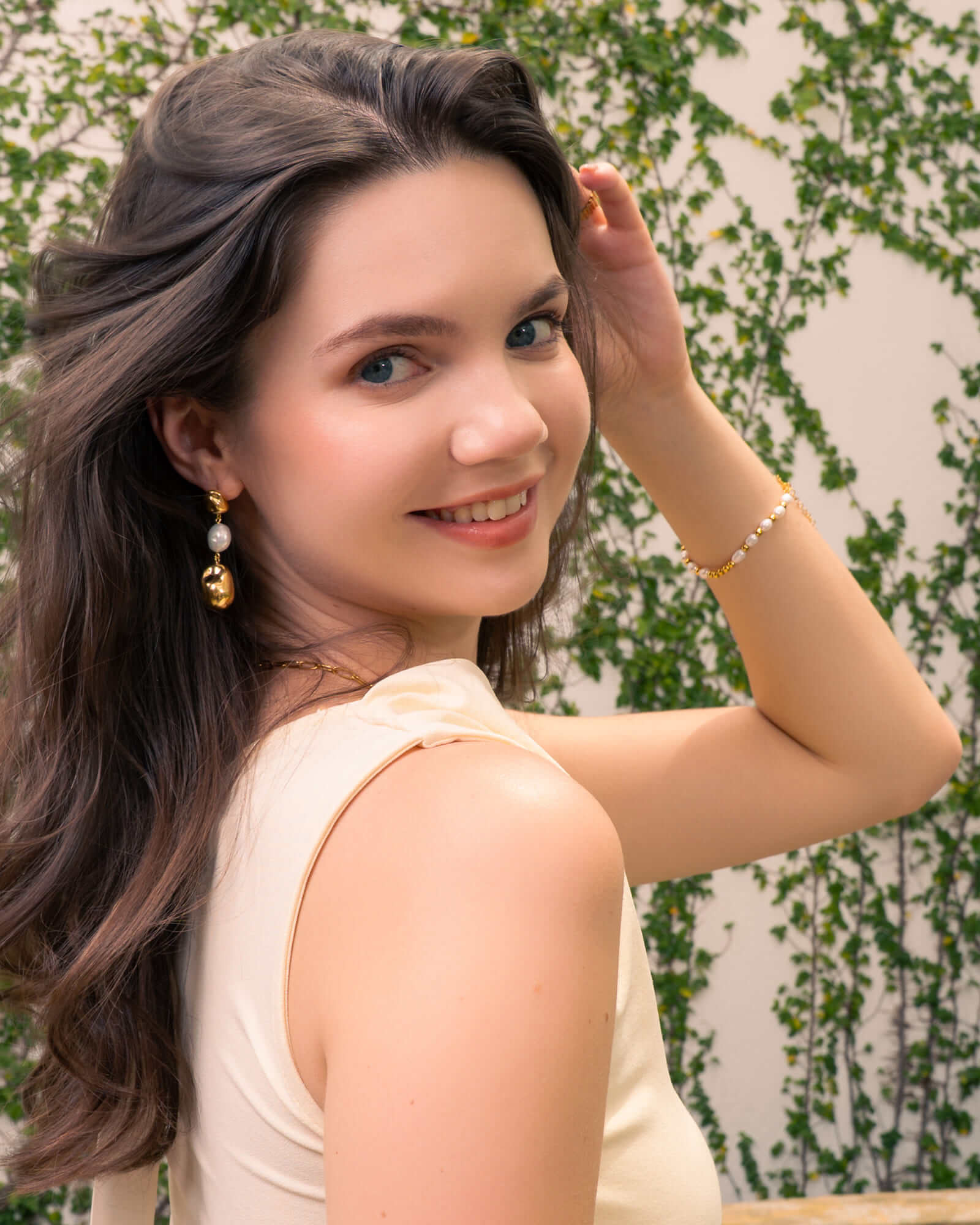 Moontide Gold Pearl Bracelet by Lavana, on model; freshwater pearls polished gold beads and extender chain 