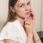 Multi Link Gold Hoop Earrings by LAVANA, on model wide chain link dress hoops design with polished finish