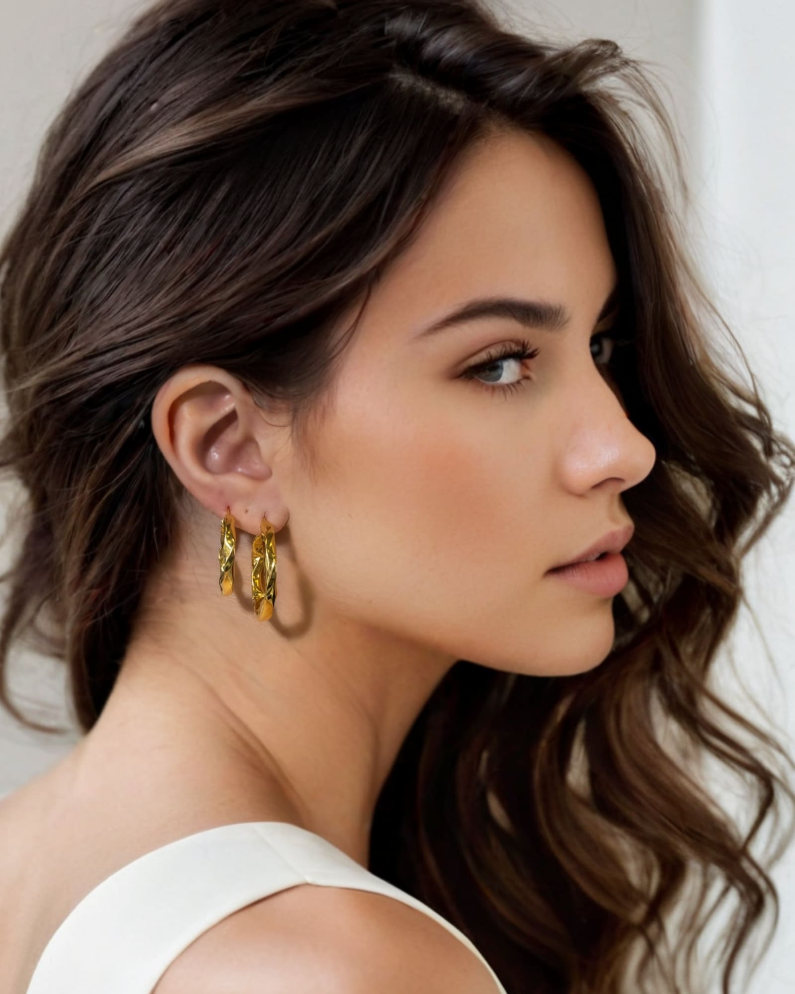 Musica Gold Hoop Earrings Large and Extra Large by Lavana on model large round hoops with fluid twist movement