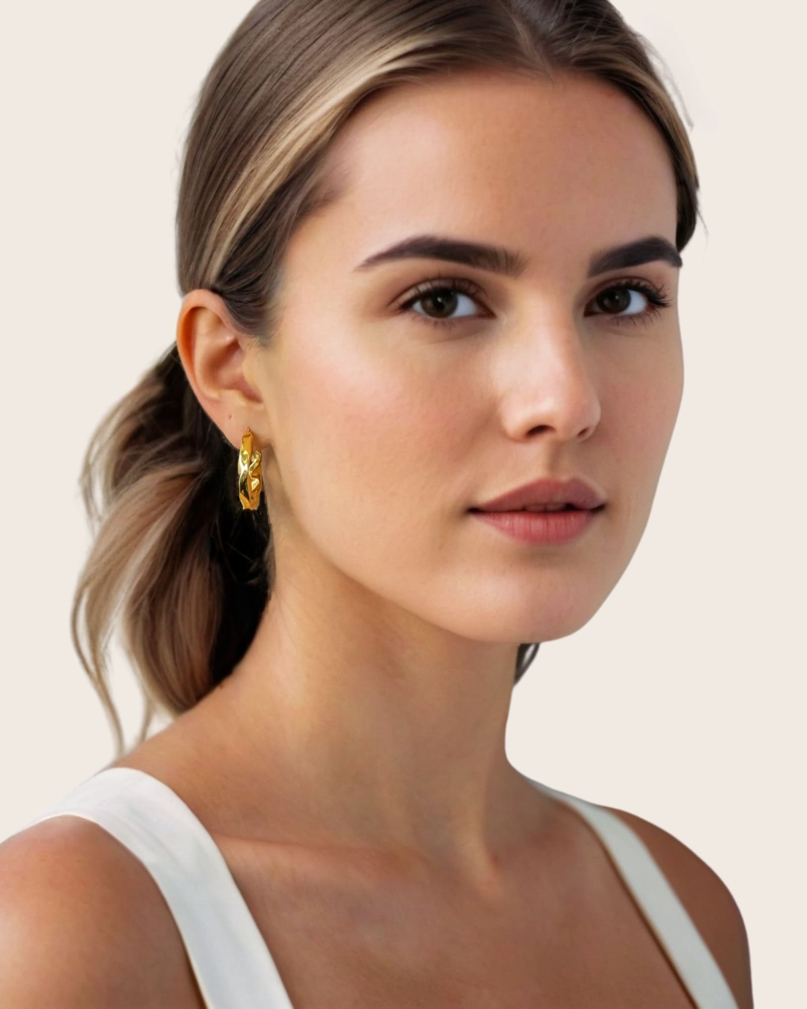 Musica Gold Hoop Earrings by Lavana, on model; large round hoops with fluid twist movement