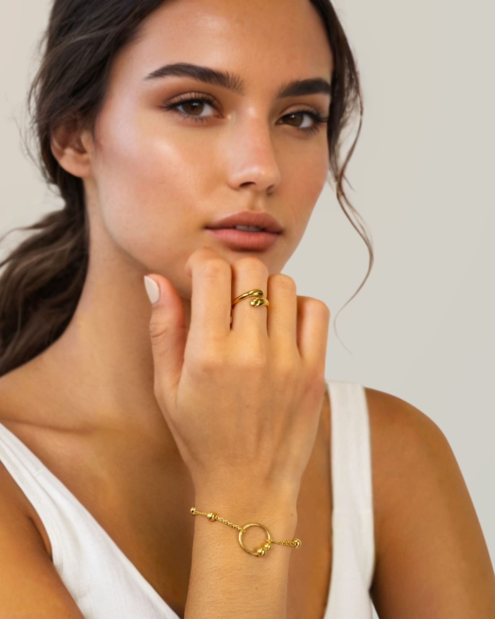 Nexus Gold Link Bracelet by Lavana on model with open ring focal and bead stations A