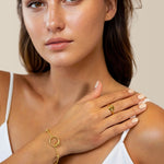 Nexus Gold Link Bracelet by Lavana on model with open ring focal and bead stations A