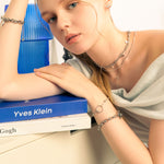 Nexus silver link bracelet by Lavana on model with open ring focal and trendy bead stations