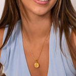 Northern Cross Diamond Pendant by Lavana on model in 18k gold plated sterling silver with diamond cardinal detail