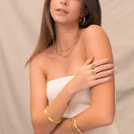 Ocean Whispers Gold Cuff Bracelet by Lavana, on model; modern sculpted wave profile 