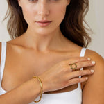Onda Gold Open Ring by Lavana on model with polished liquid wave silhouette