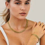 Panther Link Gold Chain Necklace Bracelet by Lavana, on model; chunky polished sculptural links 