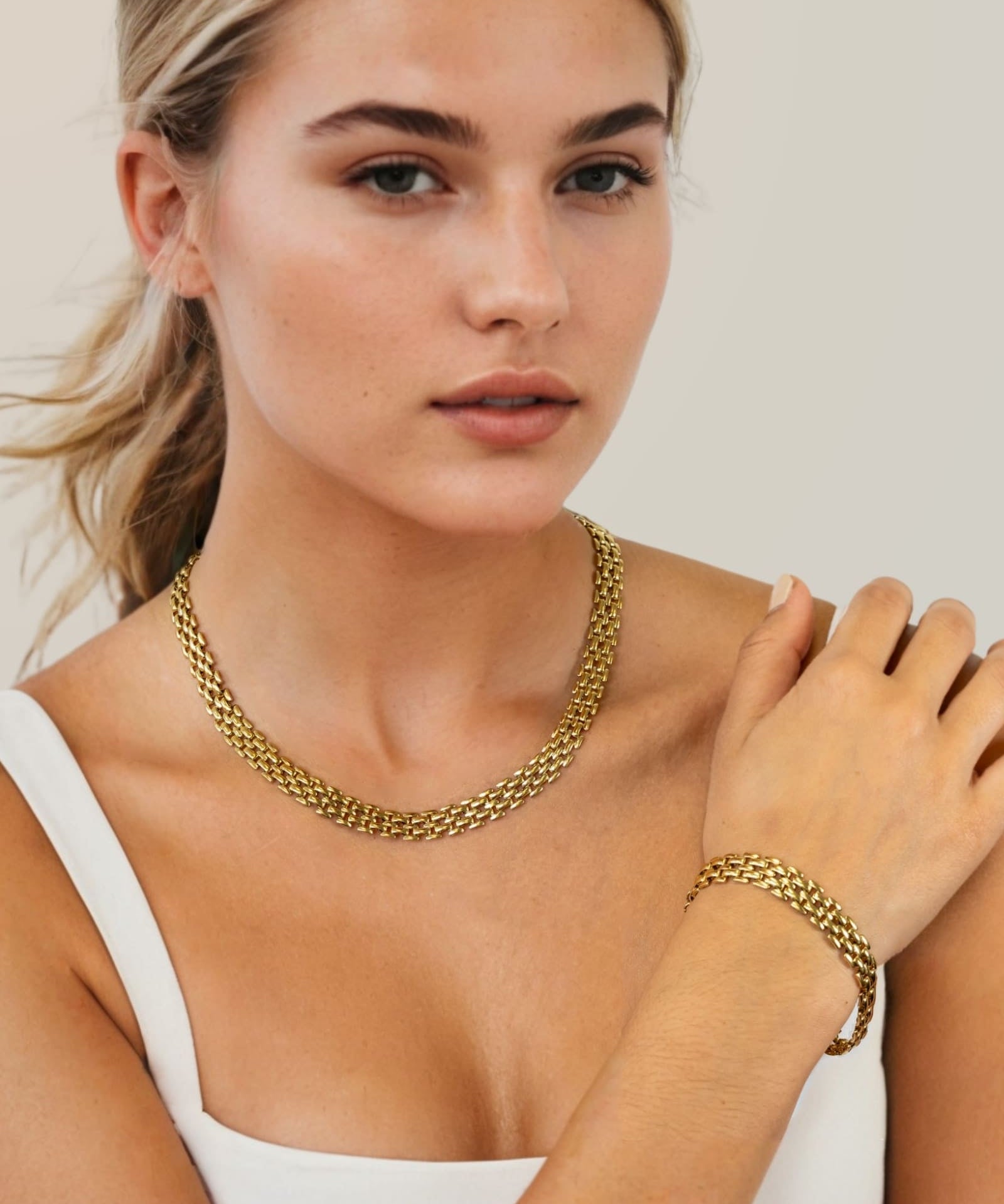 Panther Link Gold Chain Necklace Bracelet by Lavana, on model; chunky polished sculptural links 