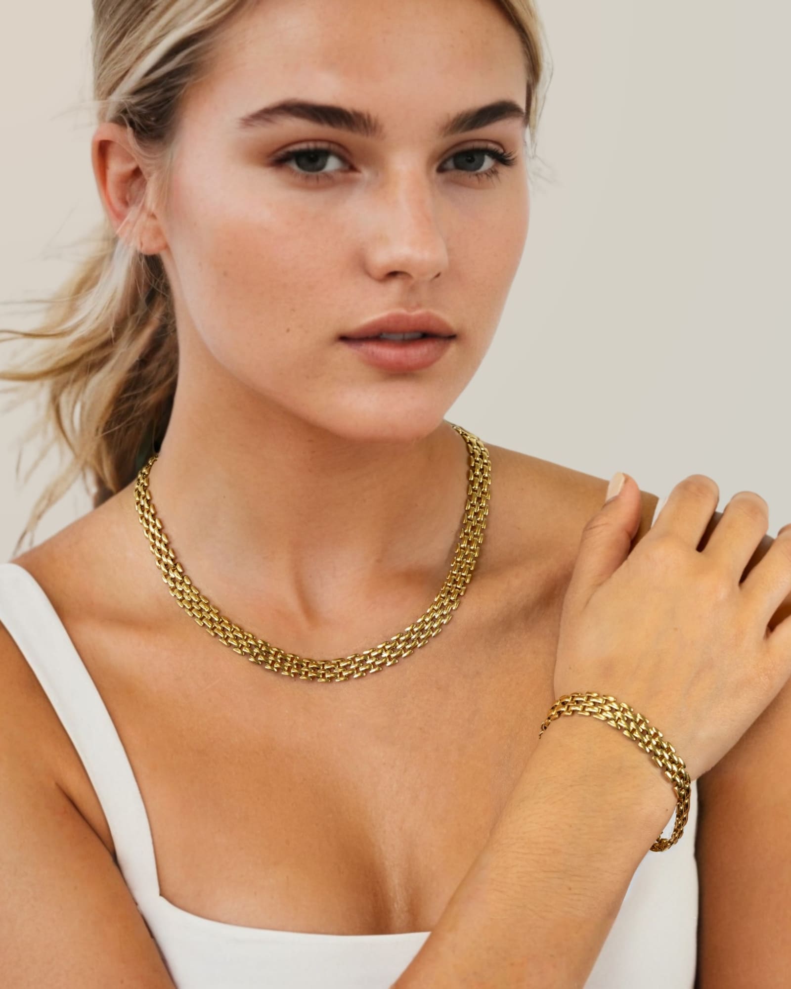 Panther Link Gold Chain Necklace Bracelet by Lavana, on model; chunky polished sculptural links 