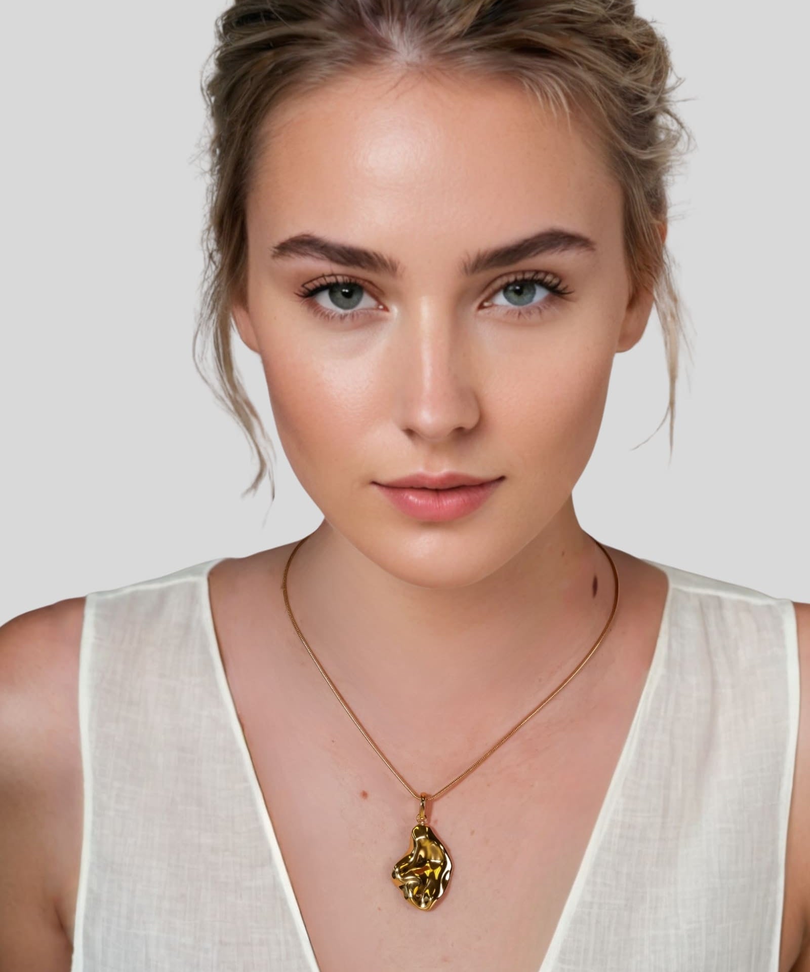 Pearlescent Reversible Gold Pendant by Lavana on model with brushed front and high polish back