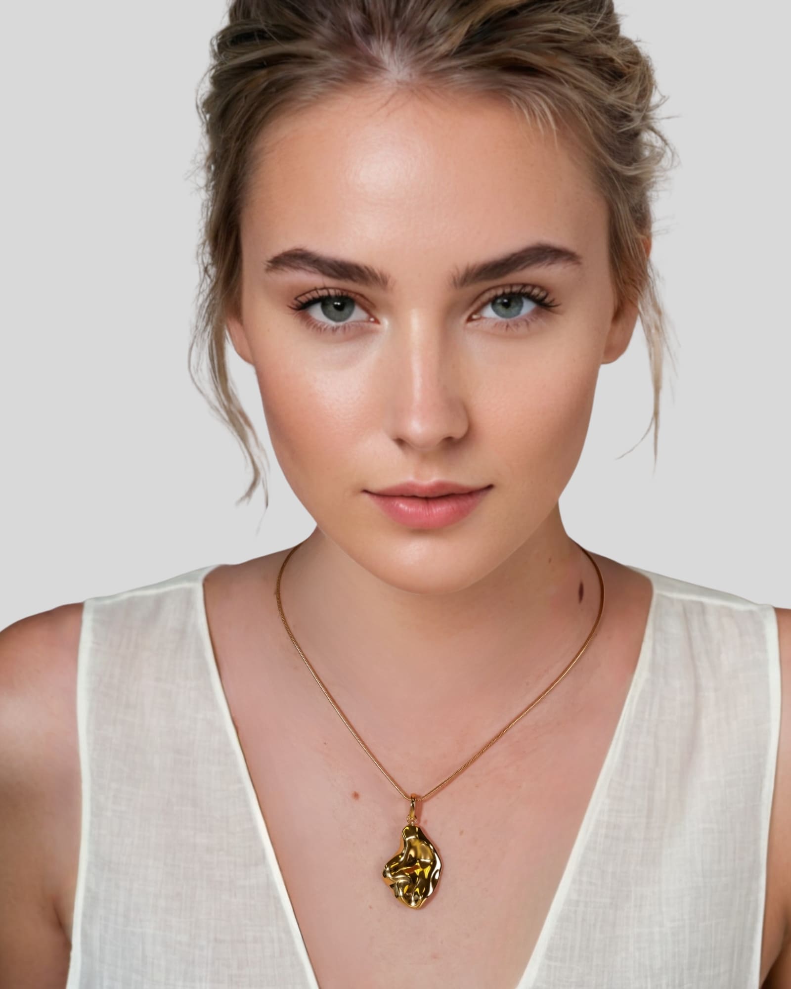 Pearlescent Reversible Gold Pendant by Lavana on model with brushed front and high polish back