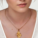 Pearlescent Reversible Gold Pendant by Lavana on model with brushed front and high polish back