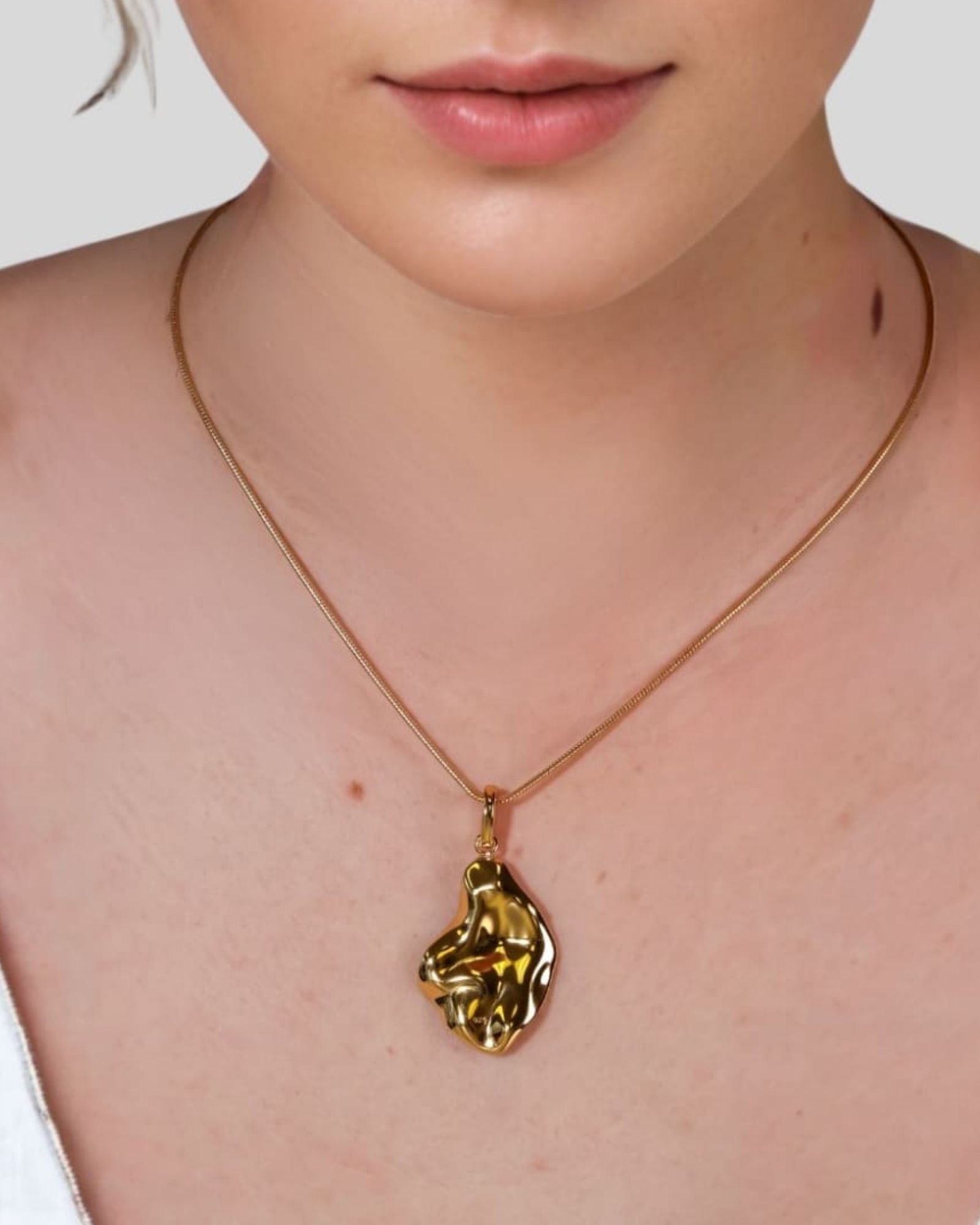Pearlescent Reversible Gold Pendant by Lavana on model with brushed front and high polish back