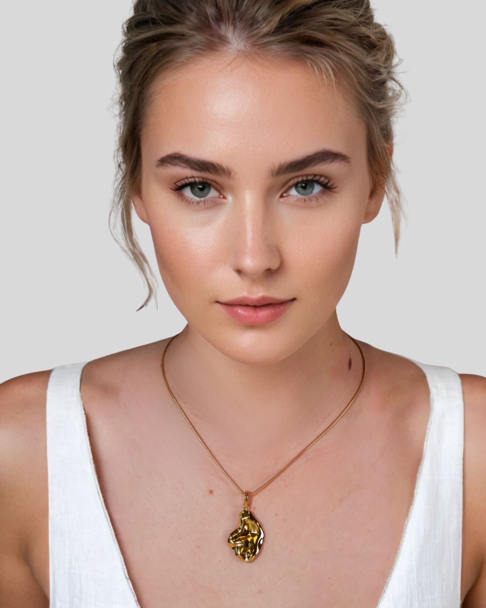 Pearlescent Reversible Gold Pendant by Lavana on model with brushed front and high polish back