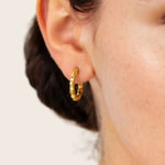 Pebble Textured Gold Hoop Earrings by LAVANA on model rounded pebble surface hoops