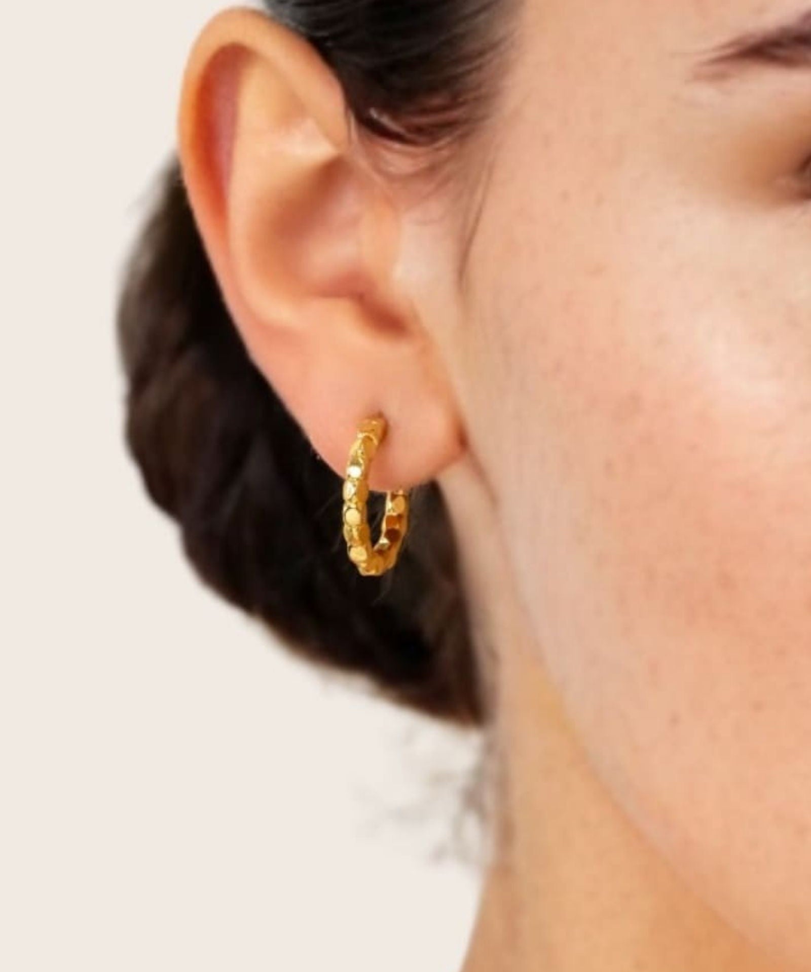 Pebble Textured Gold Hoop Earrings by LAVANA on model rounded pebble surface hoops
