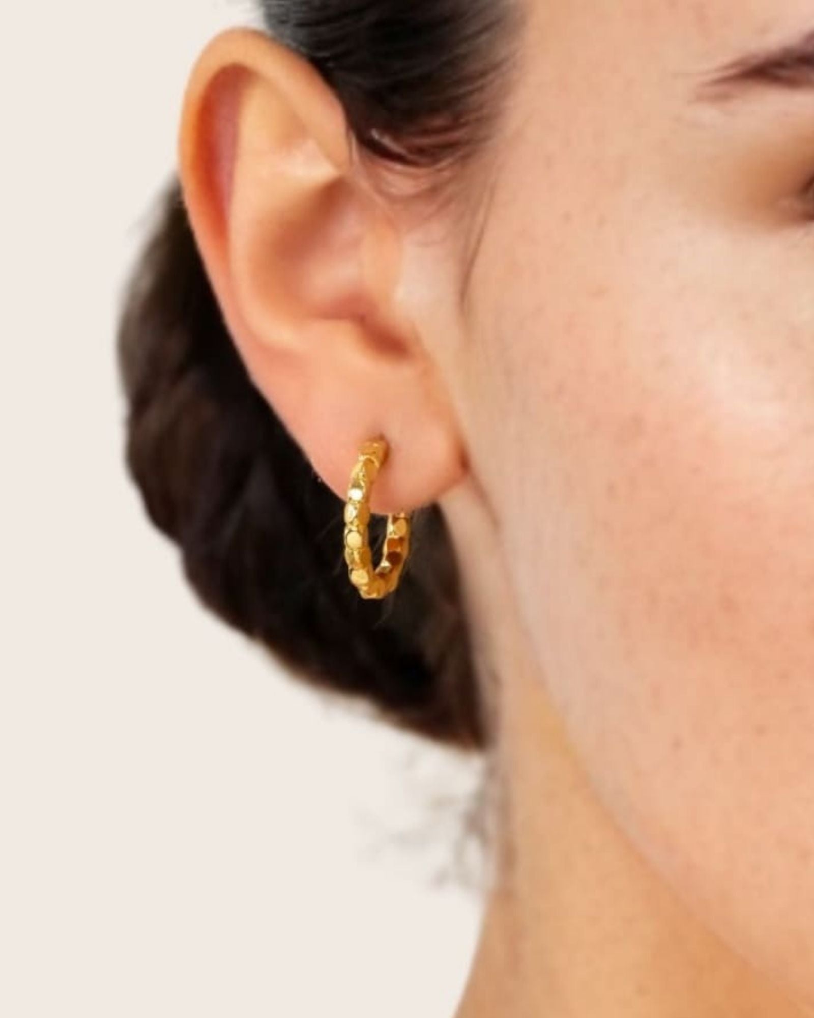 Pebble Textured Gold Hoop Earrings by LAVANA on model rounded pebble surface hoops