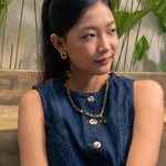 Pia Loop Gold Stud Earrings by Lavana, on model; modern sculptural open loop studs with high polish