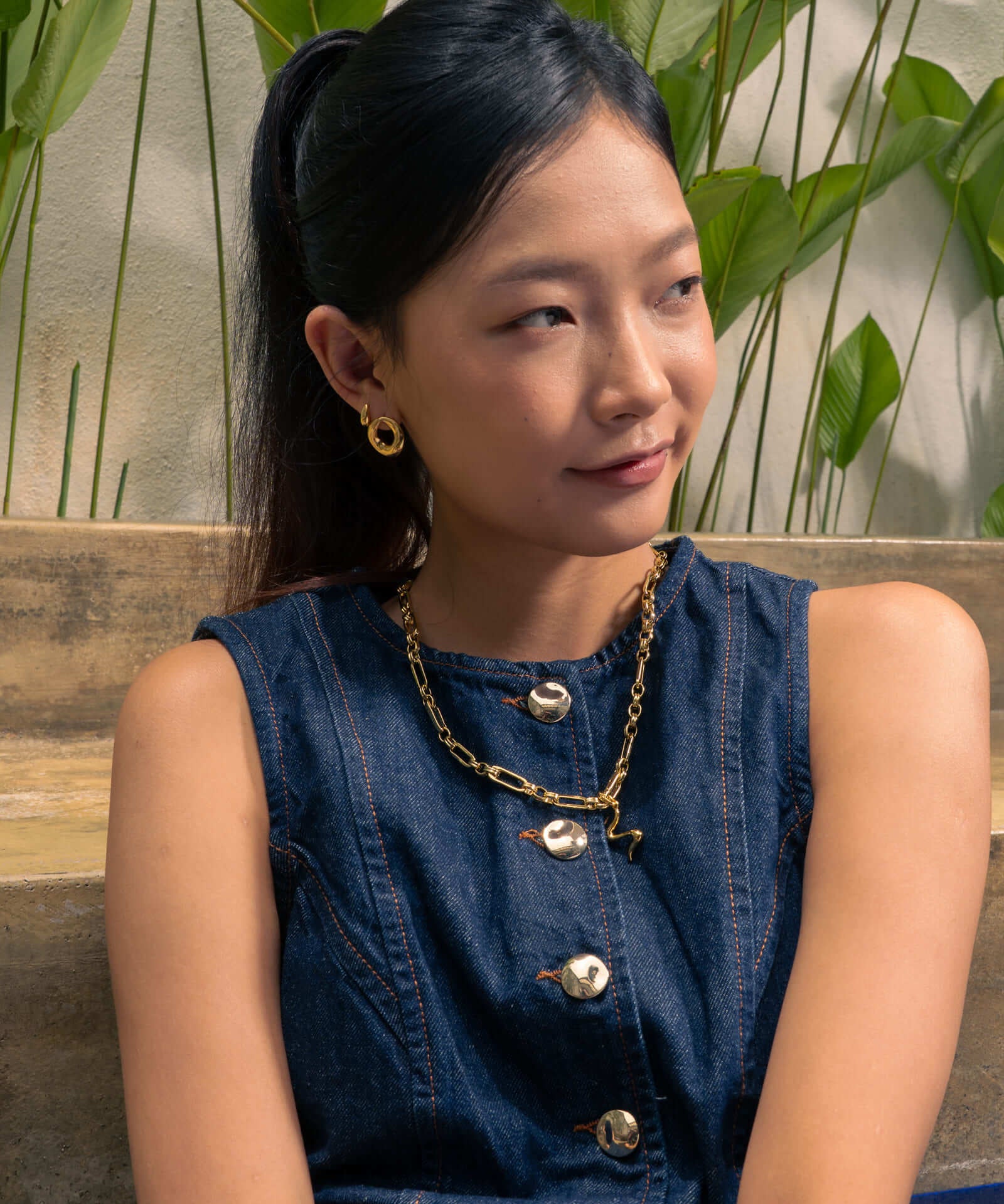 Pia Loop Gold Stud Earrings by Lavana, on model; modern sculptural open loop studs with high polish