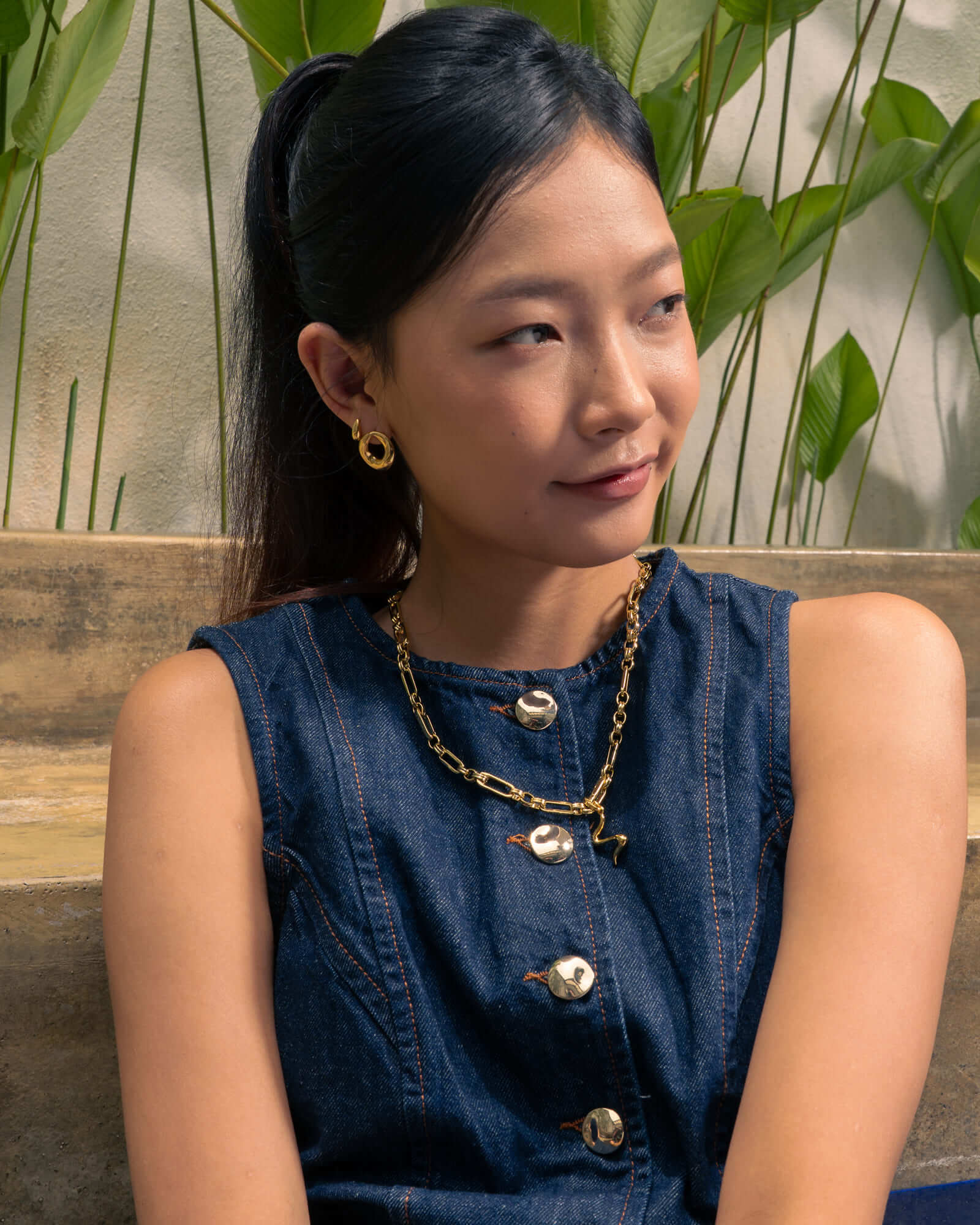 Pia Loop Gold Stud Earrings by Lavana, on model; modern sculptural open loop studs with high polish