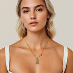 Pisces Gold Zodiac Tag Necklace by Lavana, on model; engraved tag on beaded chain, front