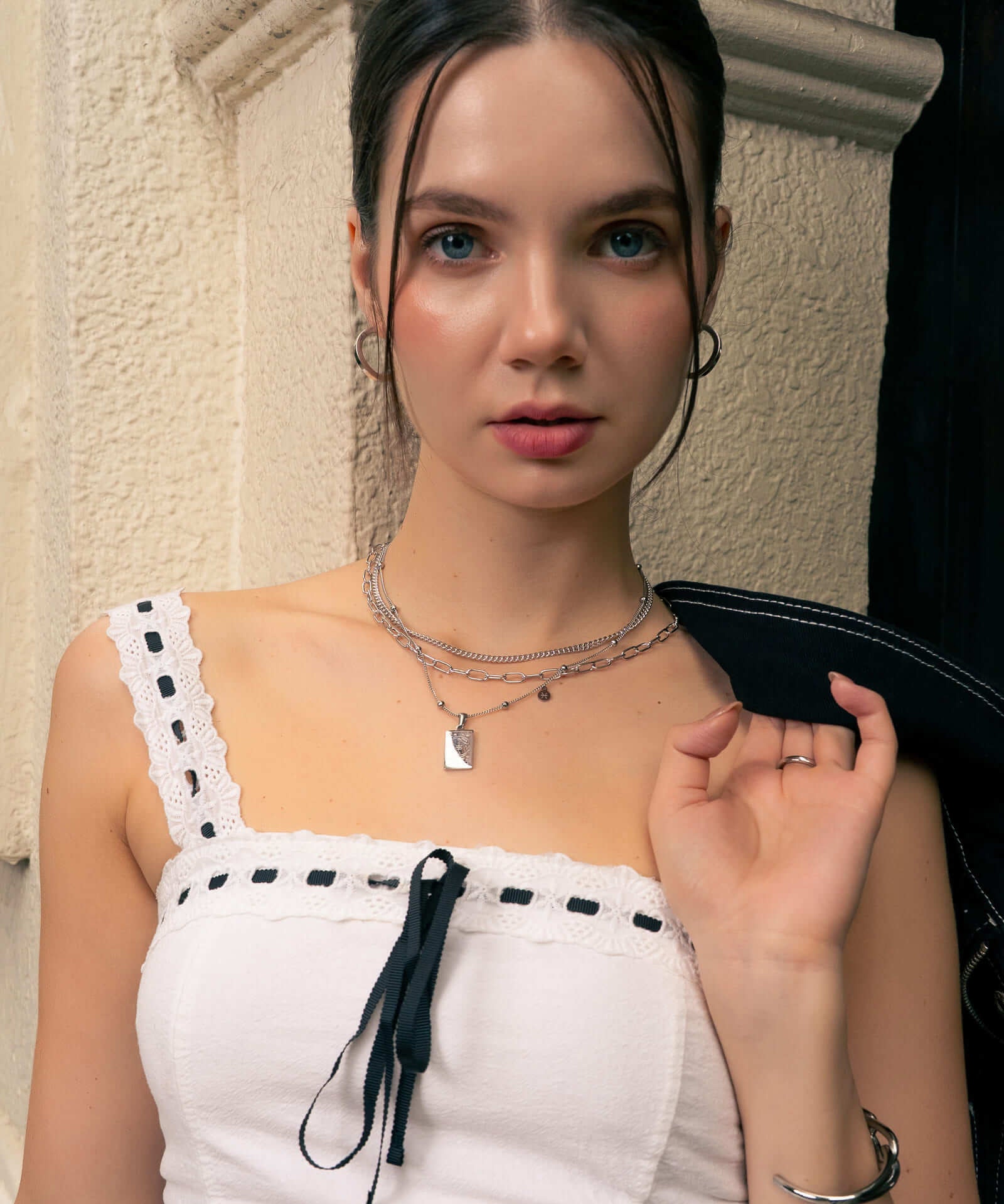 Pisces Silver Zodiac Tag Necklace by Lavana, on model; engraved tag on classic beaded chain 