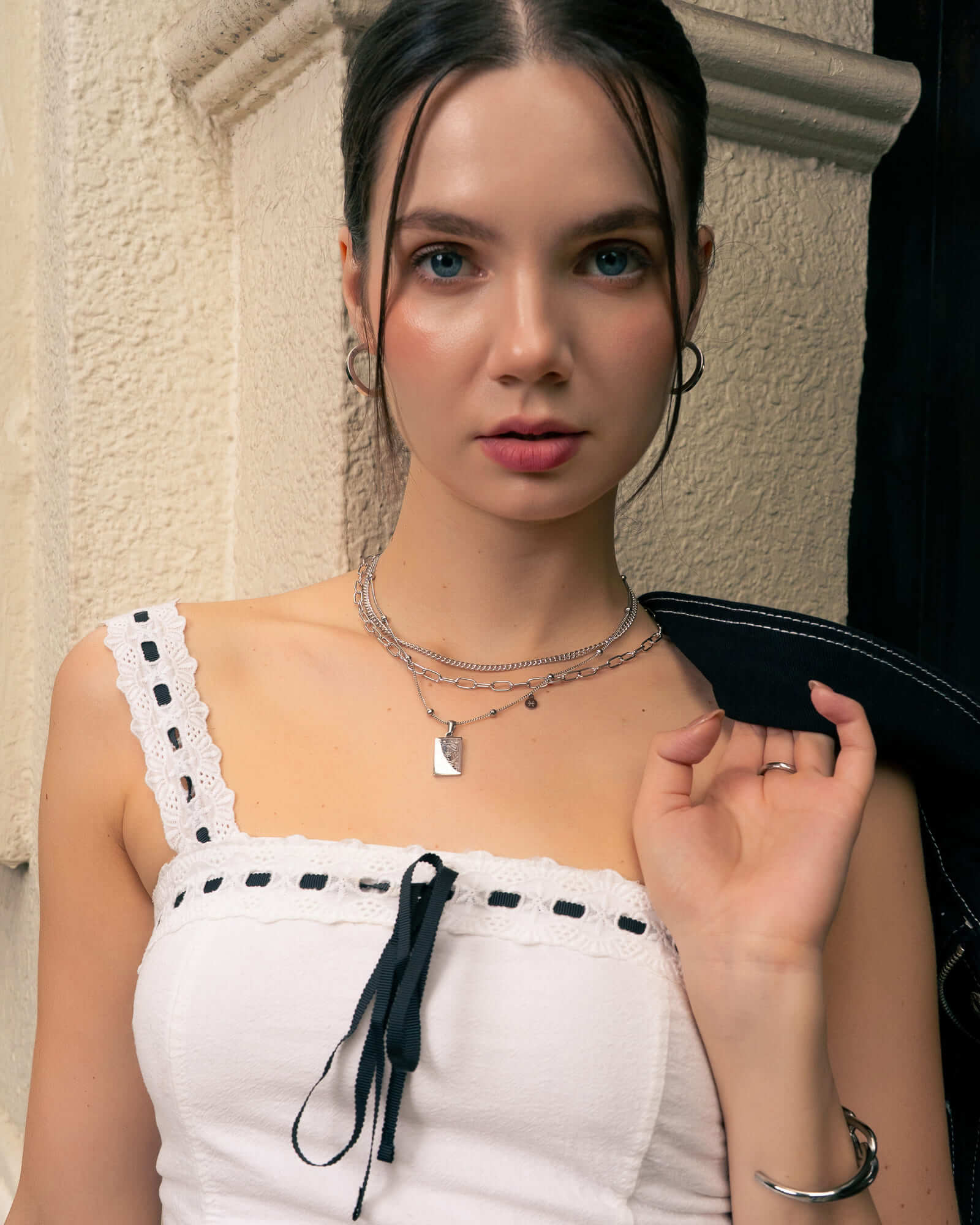 Pisces Silver Zodiac Tag Necklace by Lavana, on model; engraved tag on classic beaded chain 