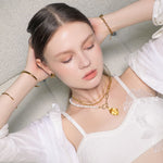 Porto Gold Curb Chain Necklace by Lavana, on model chunky polished modern curb links with smooth drape