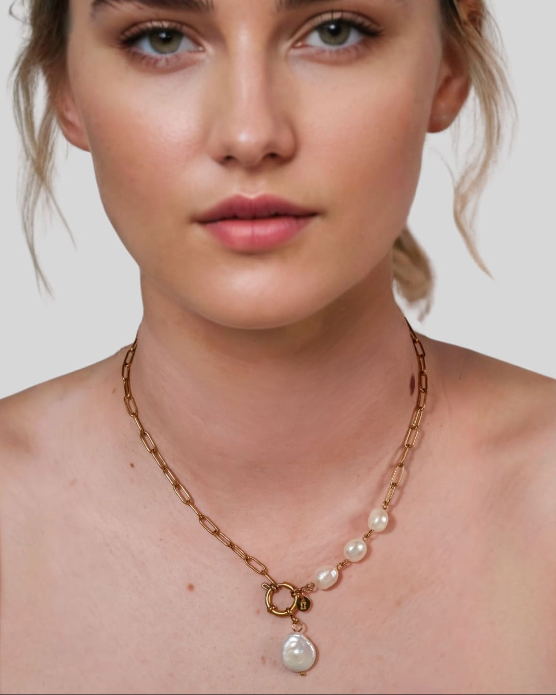 Positano Gold Pearl Necklace by Lavana on model asymmetric paperclip links with baroque pearl drop
