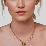 Positano Gold Pearl Necklace by Lavana on model asymmetric paperclip links with baroque pearl drop