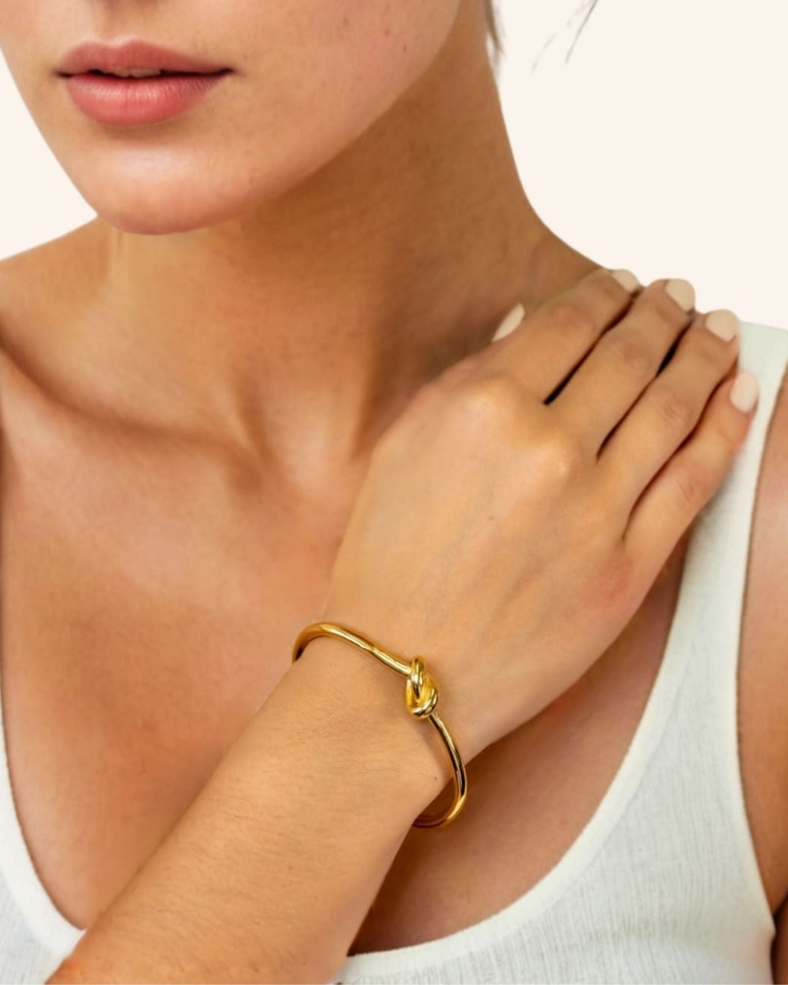 Pretzel Knot Gold Cuff Bracelet by Lavana on model with polished centre knot on an open cuff