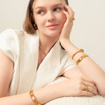 Pretzel Knot Gold Cuff Bracelet by Lavana, on model with polished centre knot on an open modern cuff