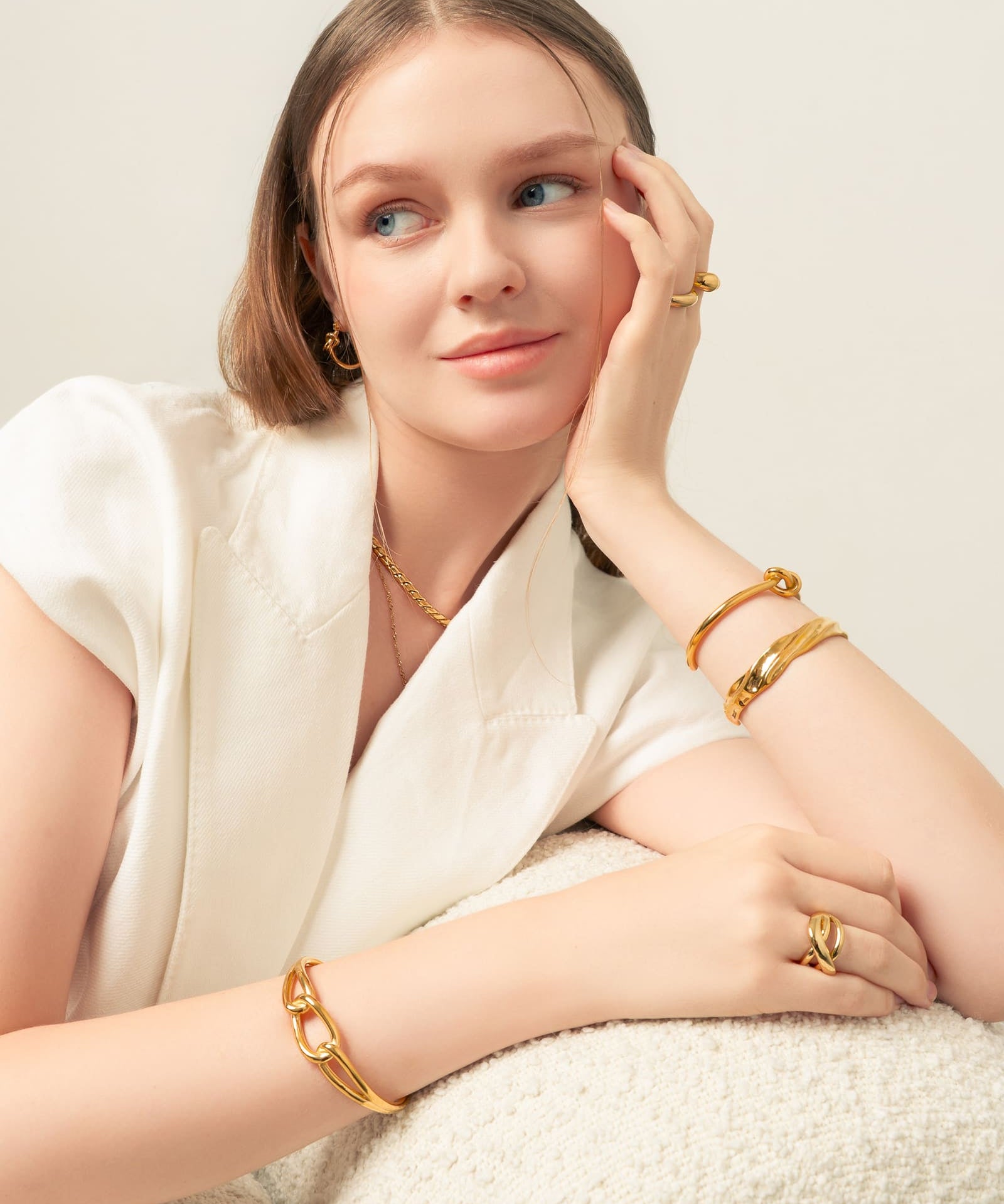 Pretzel Knot Gold Cuff Bracelet by Lavana, on model with polished centre knot on an open modern cuff