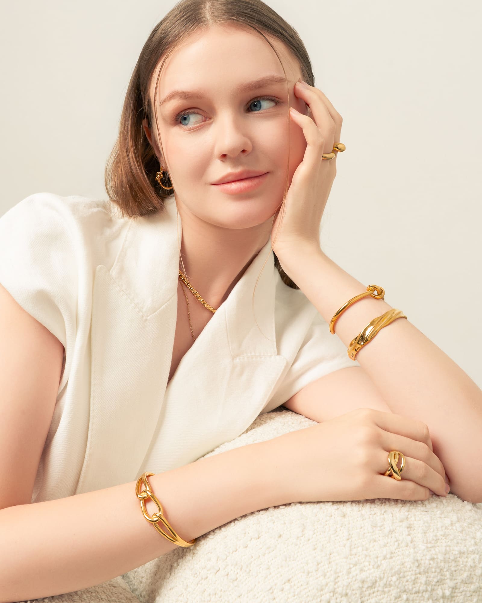 Pretzel Knot Gold Cuff Bracelet by Lavana, on model with polished centre knot on an open modern cuff