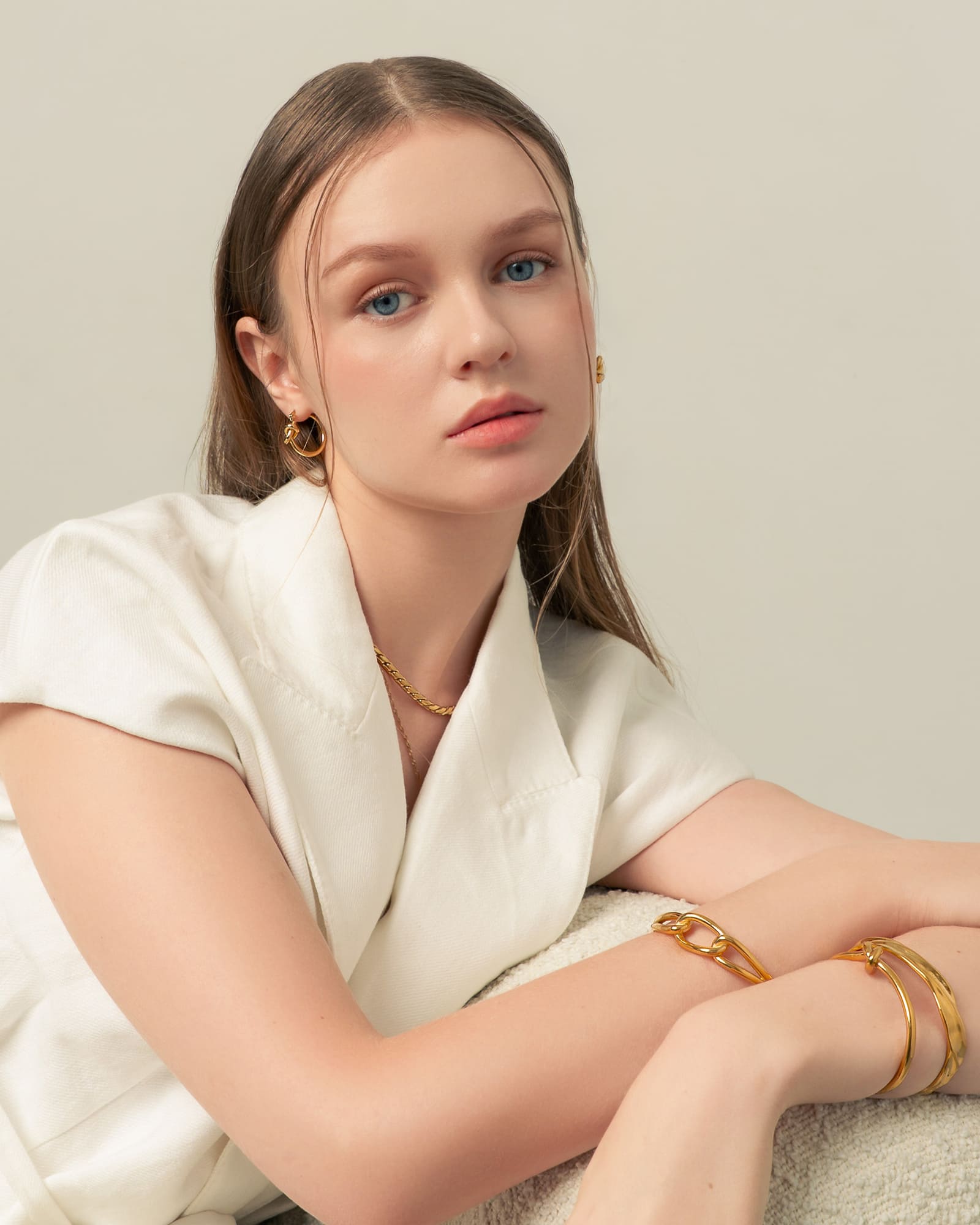 Pretzel Knot Gold Hoop Earrings by LAVANA, on model trendy Slim hoop with front twist and lever latch