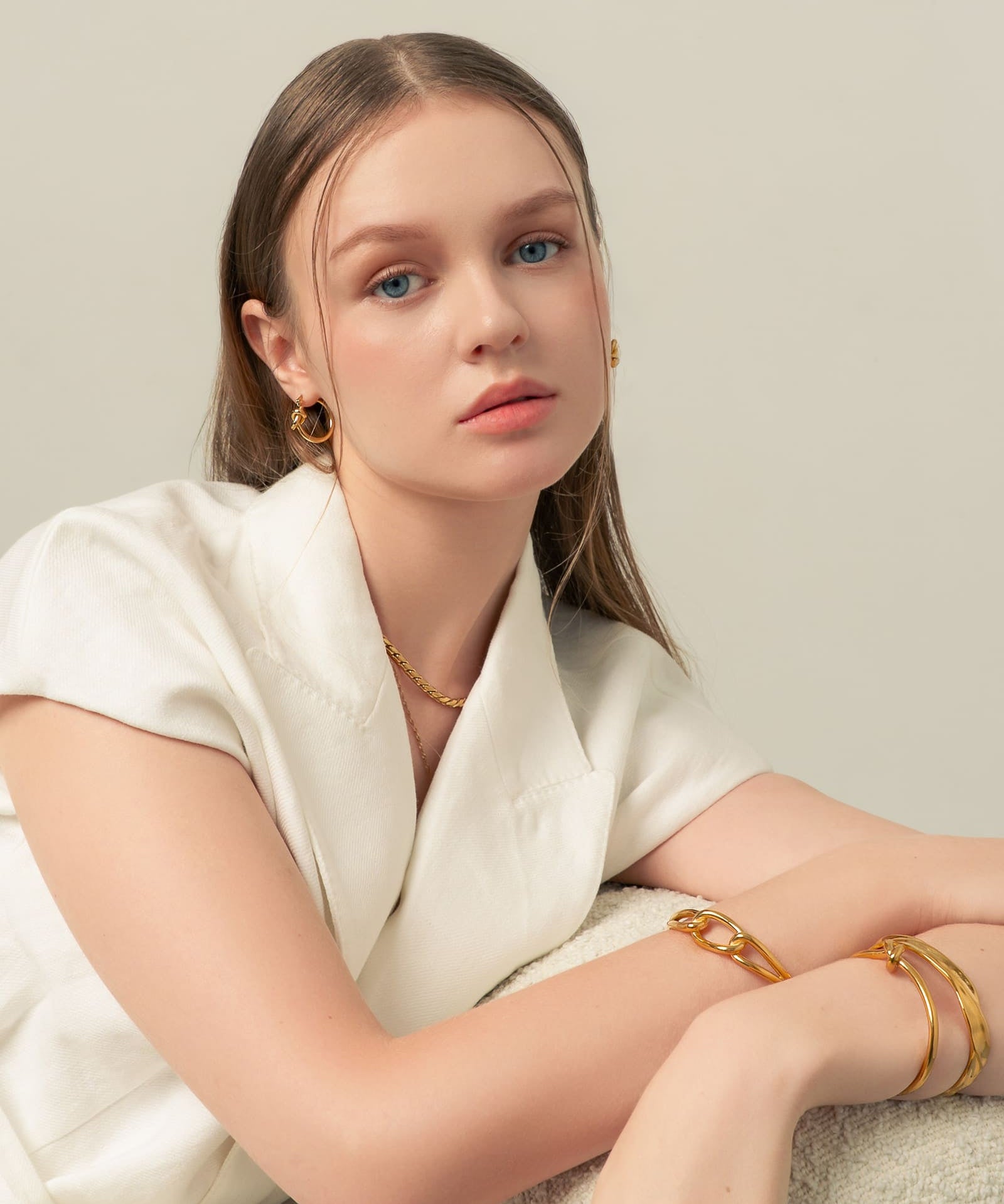 Pretzel Knot Gold Hoop Earrings by LAVANA, on model trendy Slim hoop with front twist and lever latch