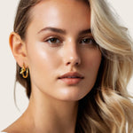 Pretzel Knot Gold Hoop Earrings by Lavana, on model; Slim hoop with front twist and lever latch