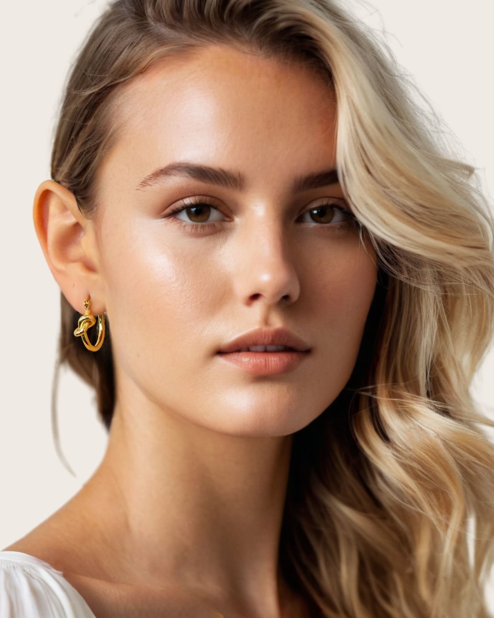 Pretzel Knot Gold Hoop Earrings by Lavana, on model; Slim hoop with front twist and lever latch