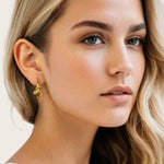 Pretzel Knot Gold Hoop Earrings by Lavana, on model; Slim hoop with front twist and lever latch