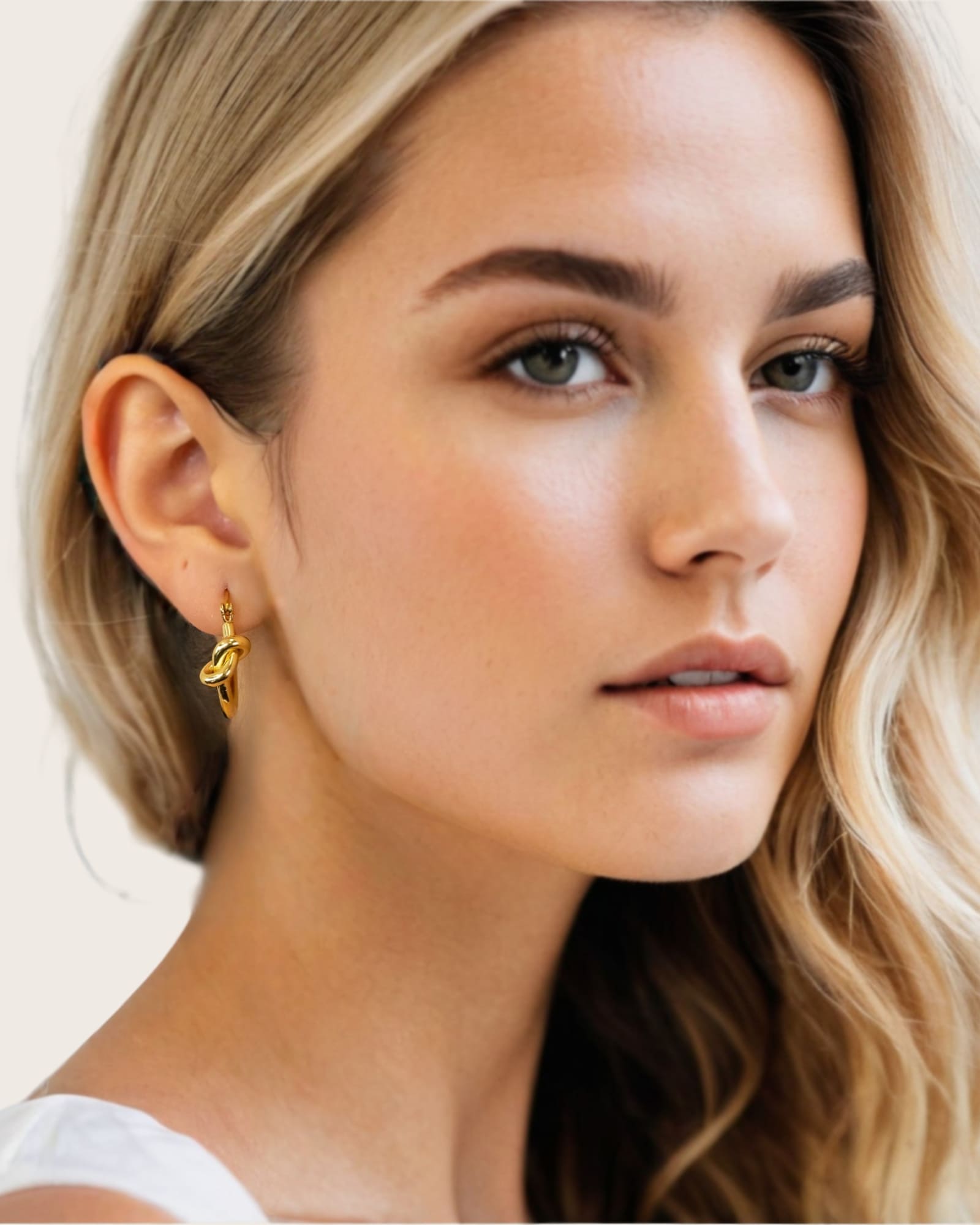 Pretzel Knot Gold Hoop Earrings by Lavana, on model; Slim hoop with front twist and lever latch