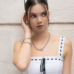 Pretzel Knot Silver Cuff Bracelet by Lavana, on model; with polished knot detail on an open classic cuff