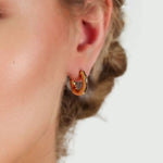 Prosperity Bamboo Gold Huggie Earrings by LAVANA on model bamboo textured ridges with a compact thick profile