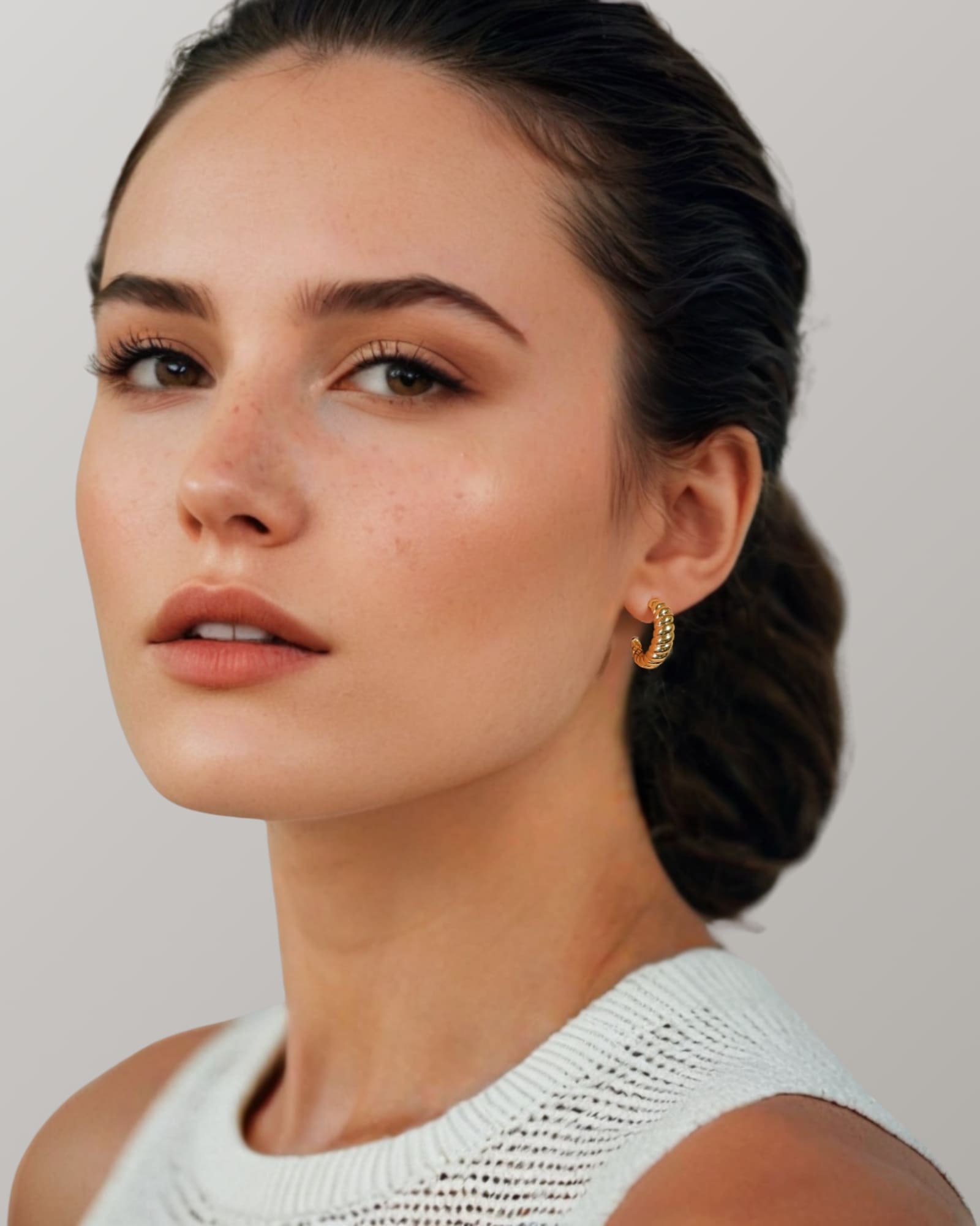 Puffy Croissant Gold Hoop Earrings by Lavana on model polished domed open hoop with croissant shape