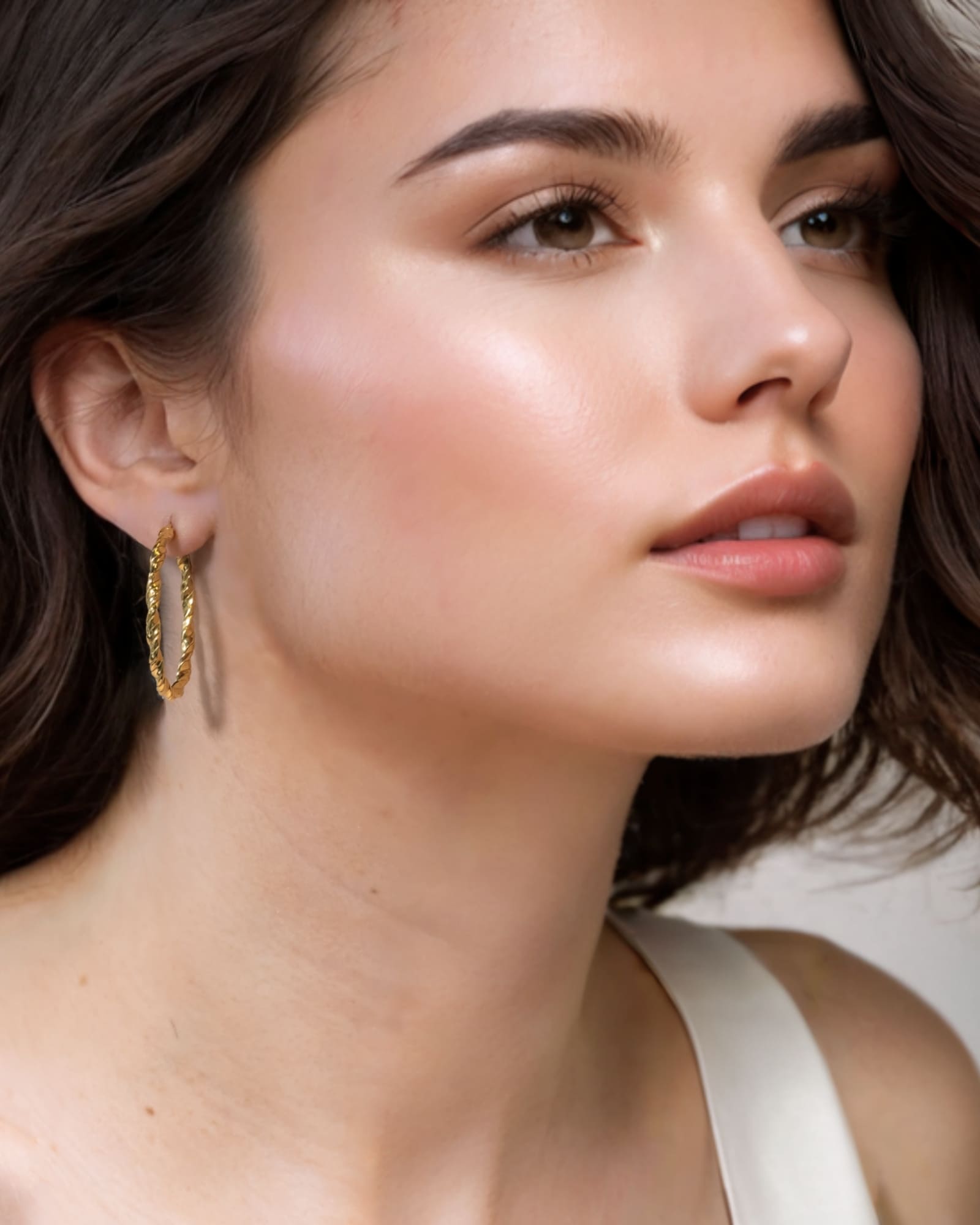 Radiance Gold Hoop Earrings by Lavana on model — lightweight large twisted textured round hoops