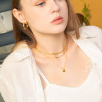 Raindrop Gold Pendant Necklace by Lavana, on model polished elegant droplet pendant on fine chain